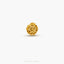 a gold bead on a white background