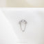 a diamond ring on top of a white cloth