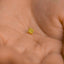 a tiny gold star on a person&#39;s hand