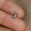 a close up of a person wearing a ring with a bird on it