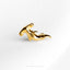 a close up of a gold brooch on a white background