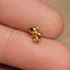a small gold plated musical note charm
