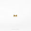 a gold bow tie on a white background