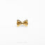a close up of a bow tie on a white surface