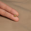 a person's hand with a gold ring on it