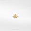 a gold ring on a white surface