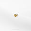 a pair of gold earrings on a white surface