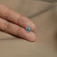 a person's hand with a ring on it