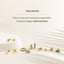 a white table topped with lots of gold rings