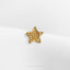 a gold pin with a spiral in the center