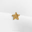 a gold pin with a spiral in the center