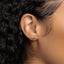 a close up of a woman's ear wearing a pair of earrings