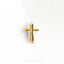 a gold cross on a white background