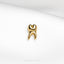 a gold brooch with a stylized figure on it