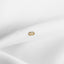 a close up of a white cloth with a gold ring