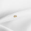 a close up of a white cloth with a gold ring