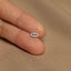 a person&#39;s hand with a tiny ring on it