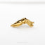 a gold brooch with a bird on it