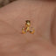 a small gold nose ring with a small gold nose ring attached to it