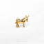 a gold horse brooch sitting on top of a white surface