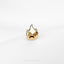 a close up of a ring with a face on it