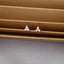 a pair of diamond earrings sitting on top of a table