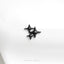 a pair of black stars on a white cloth