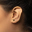 a close up of a person wearing a pair of ear piercings