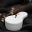 a small black and white object on a black cloth