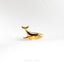 a gold whale ring on a white background