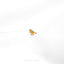 a small bird sitting on top of a white surface