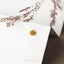 a close up of a flower on a piece of paper