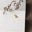 a small bird sitting on top of a white box