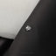 a close up of a button on a suit