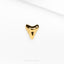 a close up of a gold plated object on a white surface
