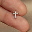 a close up of a person&#39;s finger with a cross on it