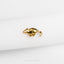 a gold brooch on a white cloth