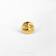 a gold skull ring on a white surface