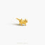 a gold brooch with a small animal on it&#39;s back