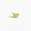 a gold brooch with a small animal on it&#39;s back