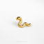 a pair of gold ear studs on a white surface