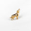 a gold dog pin with a black and white dog on it