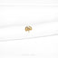 a close up of a white shirt with a gold brooch