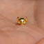 a gold cat shaped ring sitting on top of a person&#39;s hand