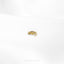 a close up of a gold brooch on a white shirt