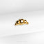 a close up of a gold ring on a white cloth