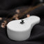 a close up of a white object with a black flower on it