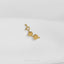 A gold-colored pendant in the shape of a flower is displayed against a white background.