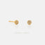 A pair of gold earrings with small, round diamonds set in the center.
