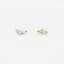 two small earrings, one silver and one gold, with a small gemstone or stone accent.